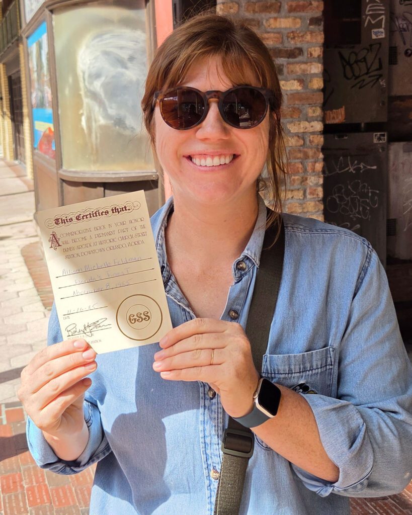 Woman holding a paper certificate