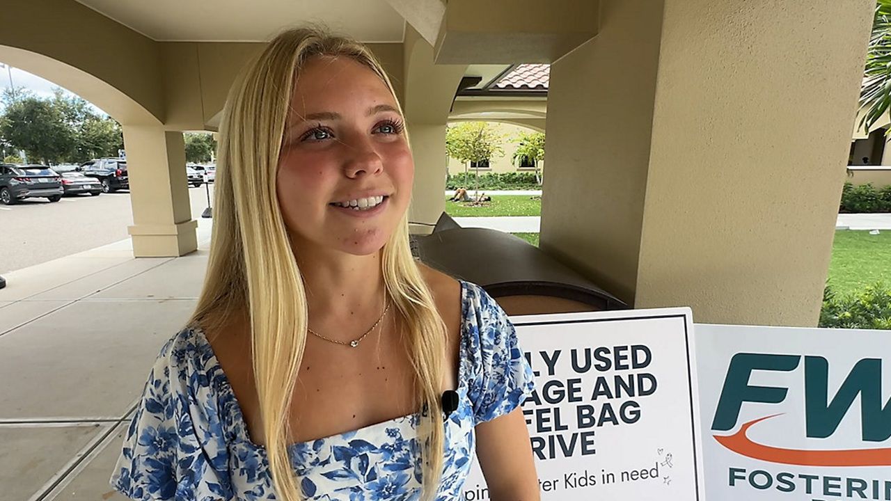HS senior Sophie Stowell collects luggage for foster kids
