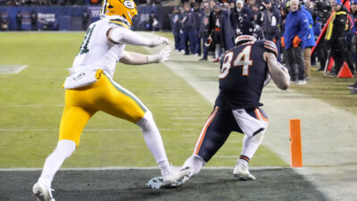Jan 10, 2026; Chicago, IL, USA; Chicago Bears tight end Colston Loveland (84) makes a catch on a two point conversion as Green Bay Packers linebacker Nick Niemann (31) defends during the second half of an NFC Wild Card Round game at Soldier Field.