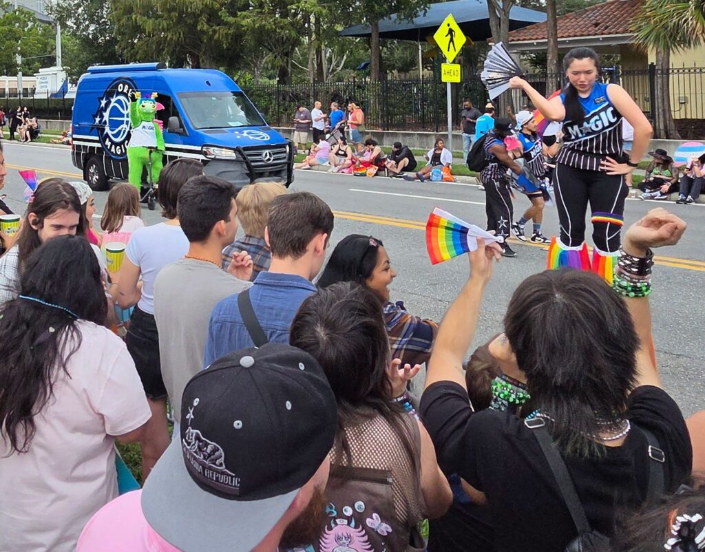Parade float with onlookers.
