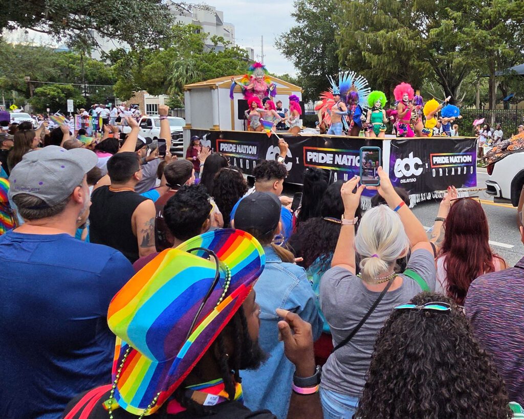 Parade float with onlookers.