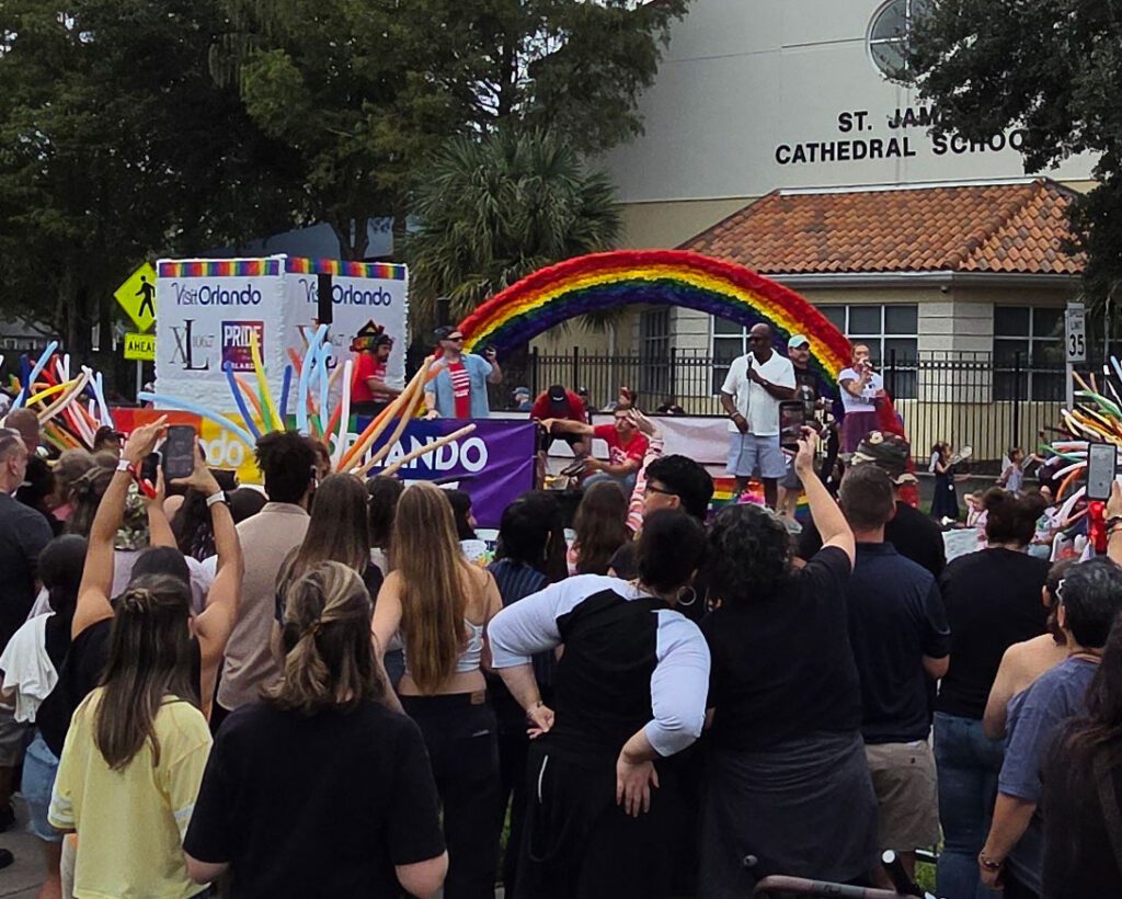 Parade float with onlookers.