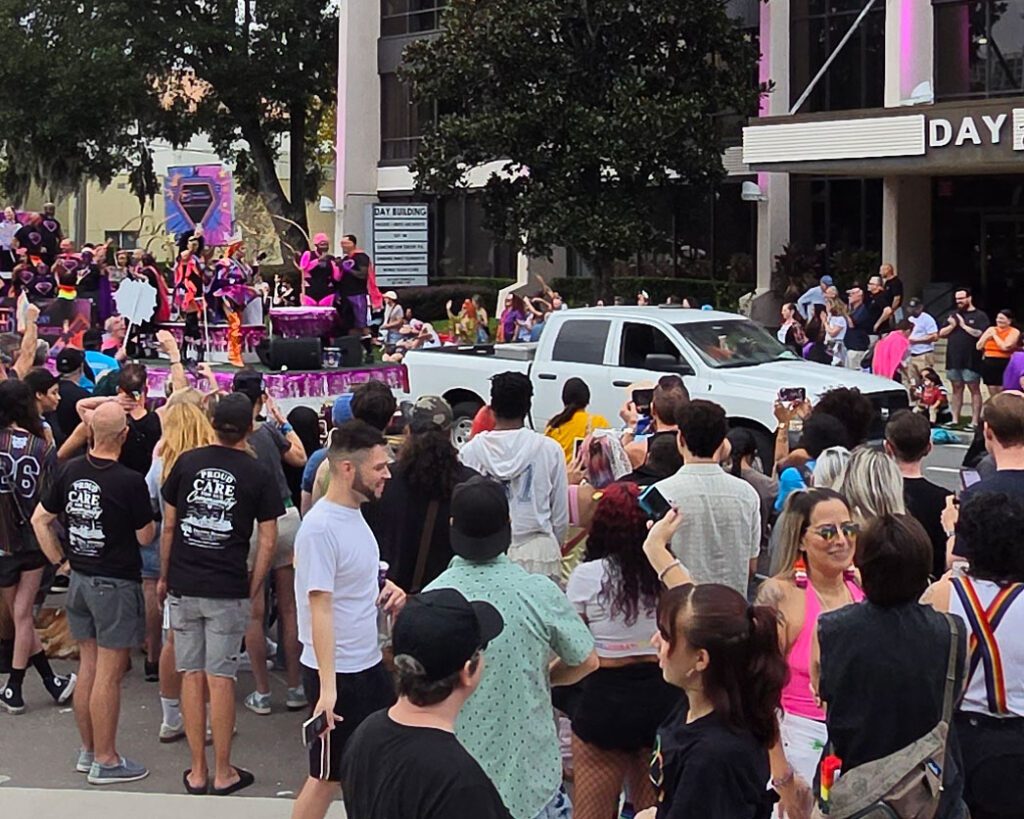 Parade float with onlookers.