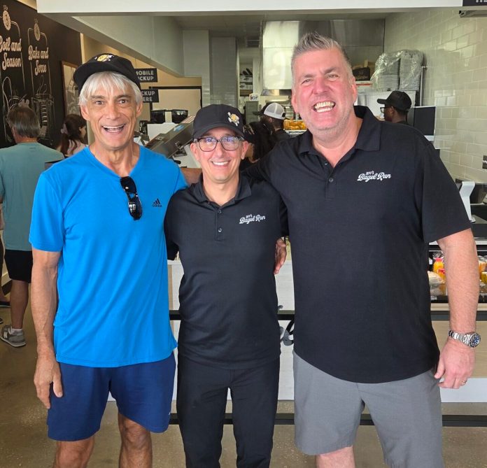 From left, Brian Bokor, Jeff’s Bagel Run co-founder Jeff Perera and franchise owner Rob Shuffield celebrate the Bloomingdale Square opening.