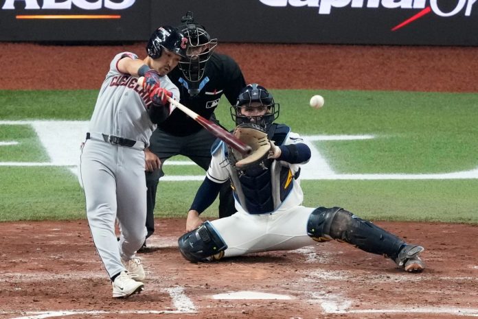Cleveland Guardians' Steven Kwan singles against the Tampa Bay Rays during the third inning in Game 1 of an American League Championship Series baseball game in St. Petersburg, Fla. Monday, Oct. 12, 2026. (AP Photo/Chris O'Meara)