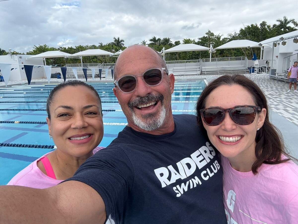 Vianney De Los Angeles, Coach Mike LaMonica and Kelly Feintech at Gulliver Raiders’ swim practice on Oct. 19, 2025.