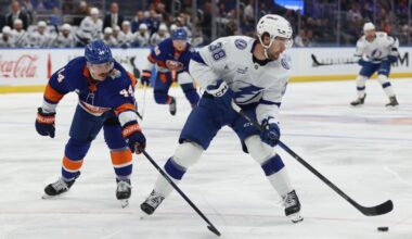 Tampa Bay Lightning's Brandon Hagel (38) skates with the puck against New York Islanders' Jean-Gabriel Pageau (44) during the first period of an NHL hockey game, Saturday, Oct. 10, 2026, in Elmont, N.Y. (AP Photo/Pamela Smith)