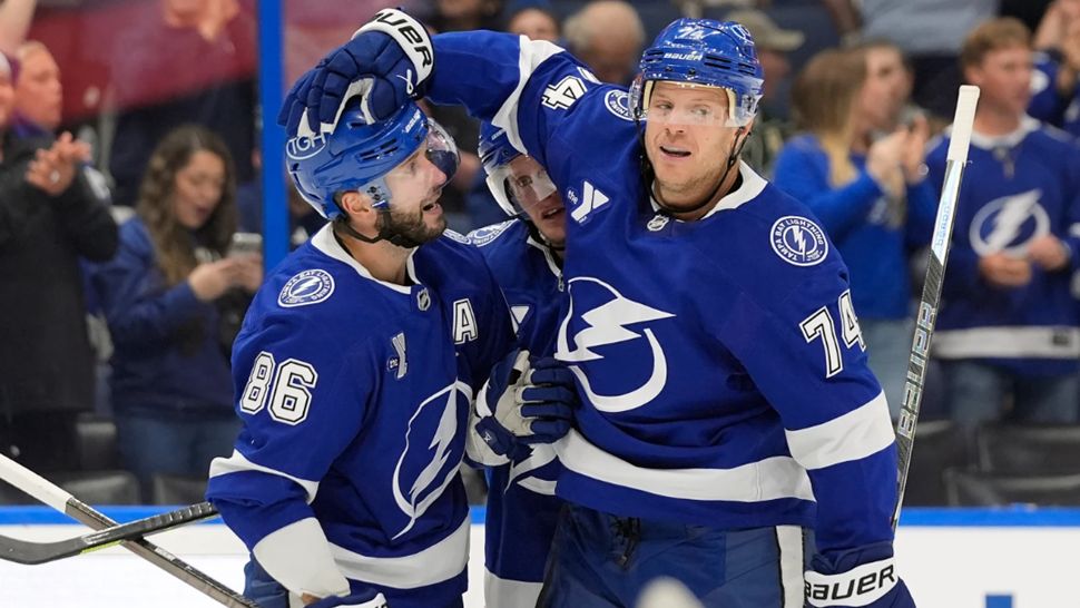 Tampa Bay Lightning defenseman John Carlson (74) celebrates his goal against the Minnesota Wild with right wing Nikita Kucherov (86) during the second period of an NHL hockey game Thursday, Oct. 8, 2026, in Tampa, Fla. (AP Photo/Chris O'Meara)
