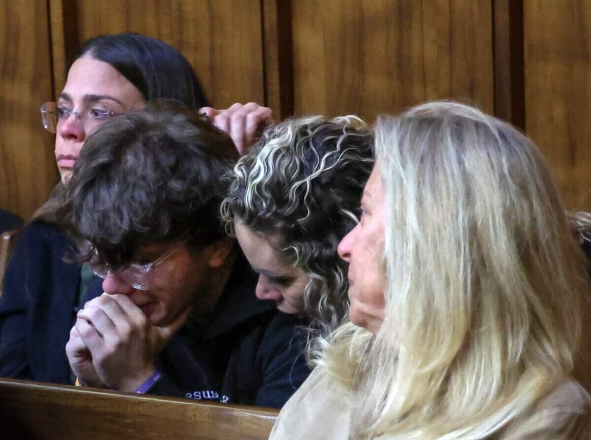 Michael Padrino Jr., the son and brother of the victims, is consoled by his adoptive mother and his mother’s friend as the verdict is read in Alberto Sierra’s death penalty sentencing trial on Tuesday, Oct. 20, 2026. The jury recommended that Sierra be sent to Death Row for murdering his wife and her two young daughters.