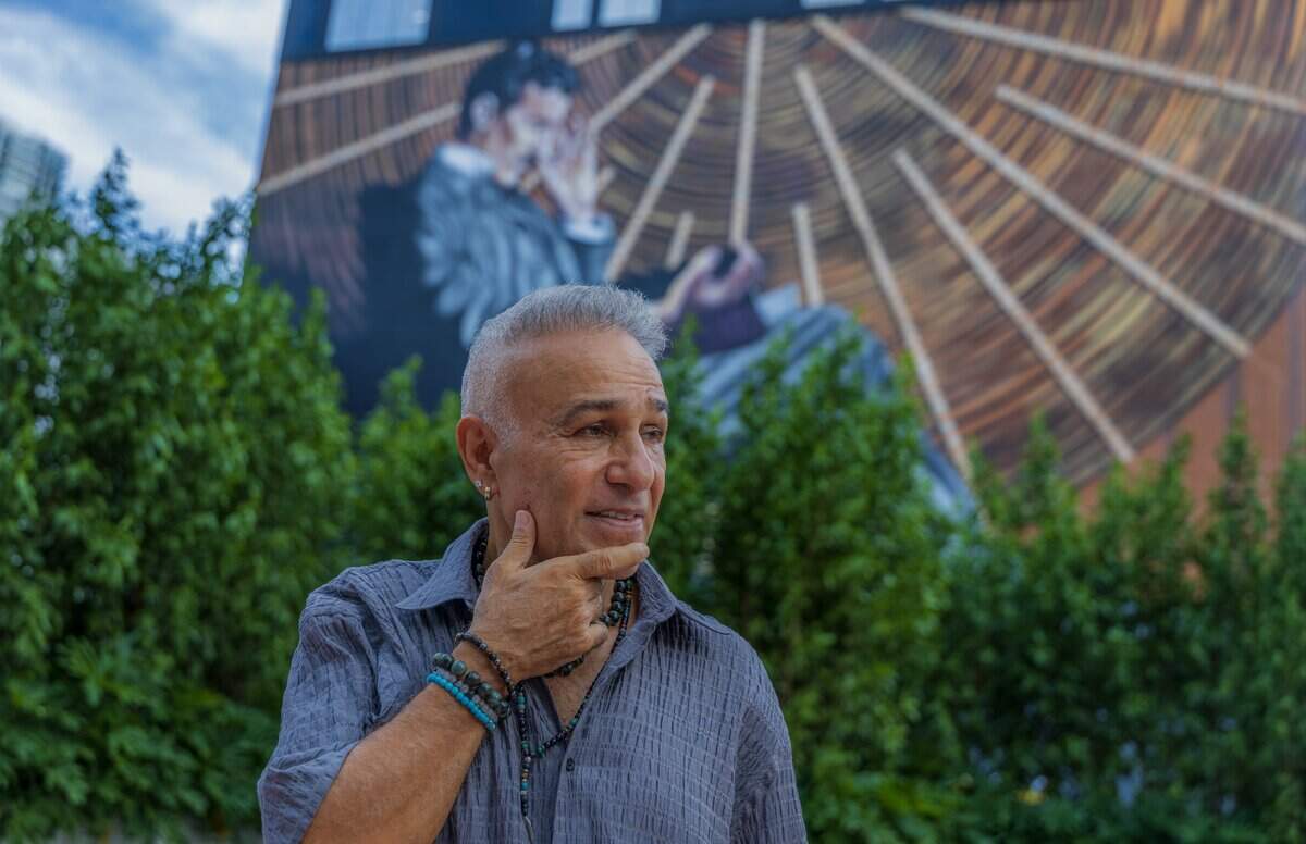 Billionaire real estate developer Moishe Mana stood in front of a mural of Nikola Tesla on the exterior of his Nikola Tesla Innovation Hub, a 13-story tech and office development.