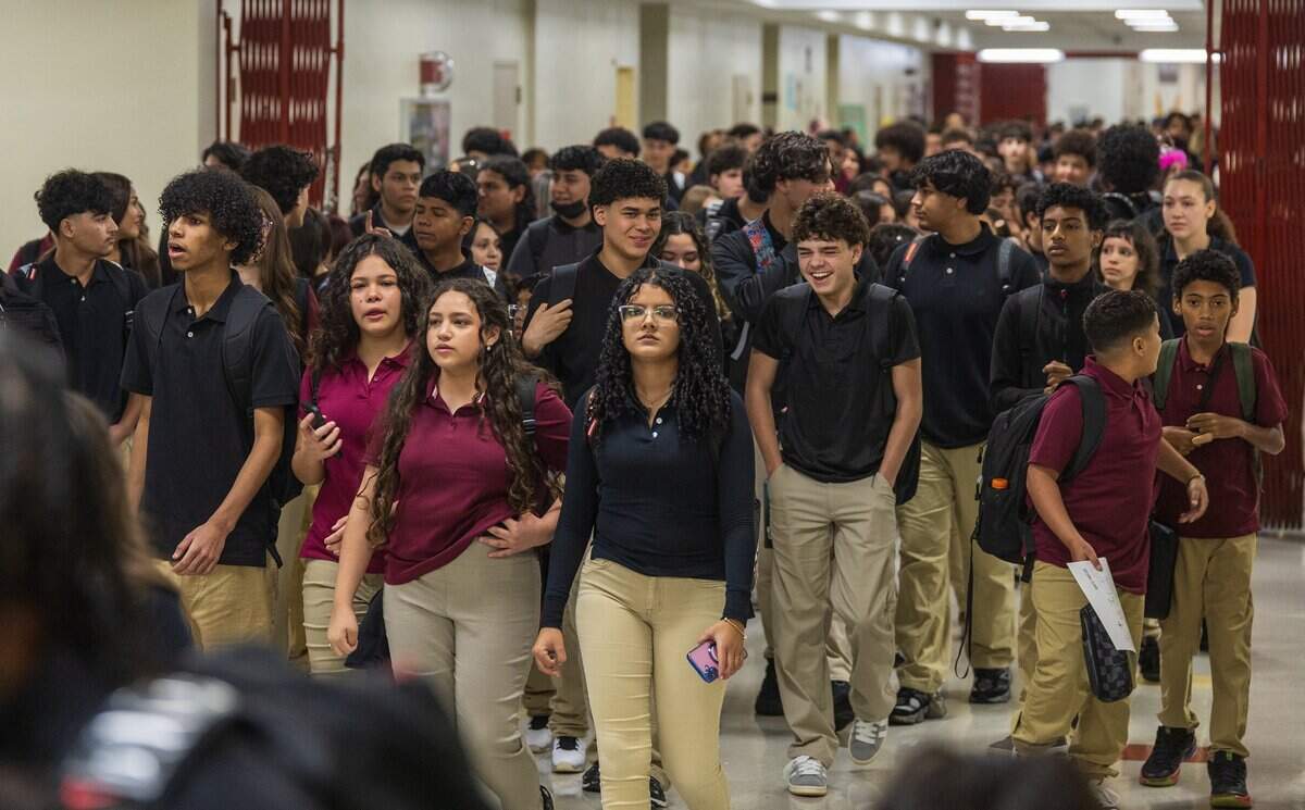 Students walk along the hallway as they arrive to Miami Springs Preparatory Academy 6-12, on the first day of school for Miami-Dade Public Schools, on Thursday, Aug 13, 2026.