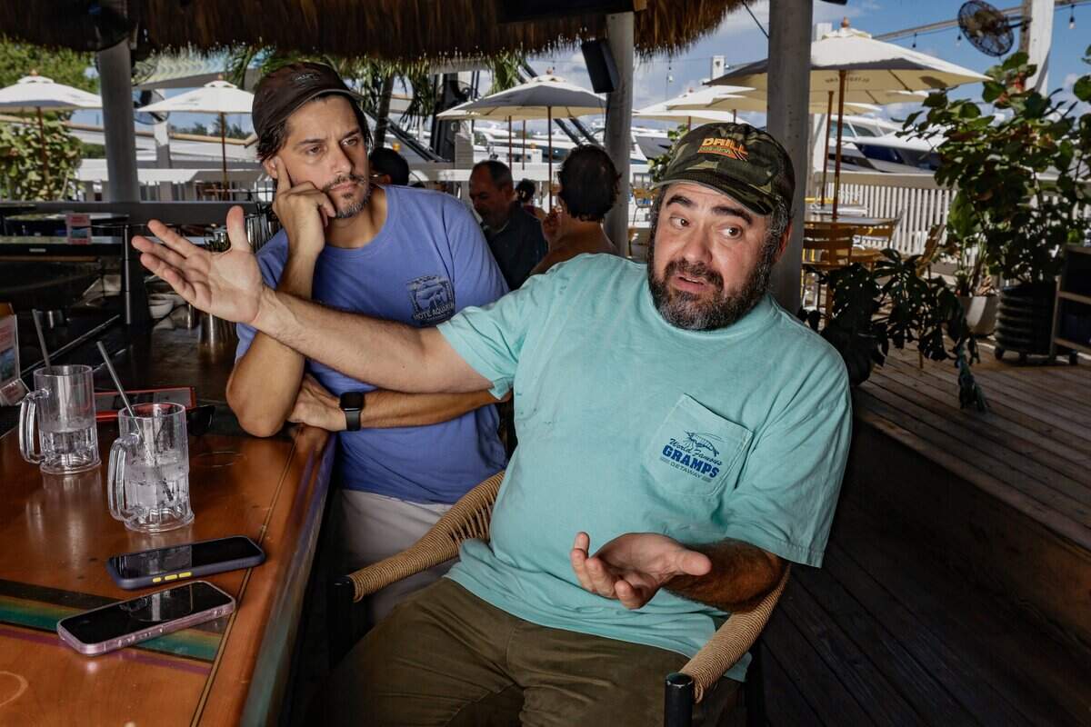 Adam Gersten, owner of Gramps Getaway, speaks about the City of Miami referendum 3 which will be on the November ballot, while at his restaurant along the Rickenbacker Causeway in Miami, Florida, on Tuesday, October 6, 2026. Standing behind him is senior advisor Justin Mendoza Routt. Miami voters will decide whether to lease about 27.6 acres of publicly owned waterfront on Virginia Key to a private developer for up to 75 years.
