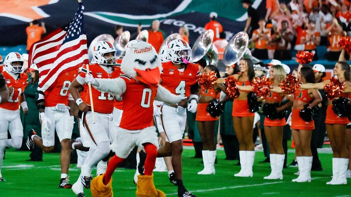 The Miami Hurricanes run onto the field for the start of the football game against the Florida State Seminoles at Hard Rock Stadium in Miami Gardens, Florida, on Saturday, October 17, 2026.