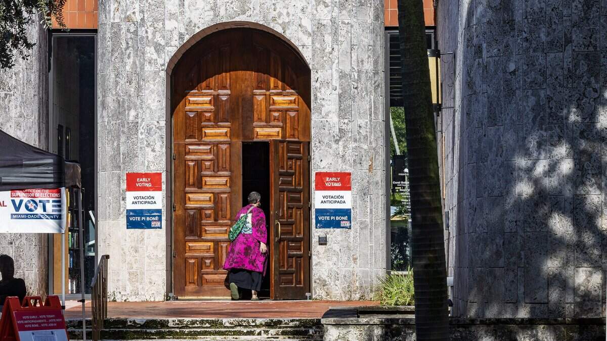 Residents walk inside of the Coral Gables Branch Library poll site to vote during the last weekend of early voting, looking ahead to Tuesday's election, on Saturday August 15, 2026.