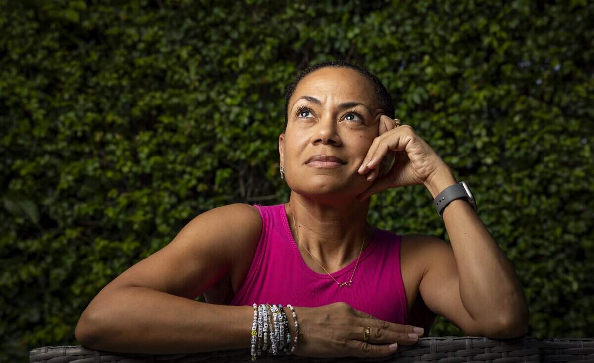 Vianney De Los Angeles, 49, a breast cancer survivor, is photographed at her home on Friday, Oct. 9, 2026, in Miami, Fla. A routine physical two years ago led to an early mammogram and a diagnosis of stage 2 invasive ductal carcinoma.