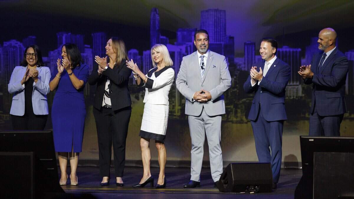 Rafael Villalobos, center, stands with school board members during his swearing ceremony as Superintendent of Miami-Dade County Public Schools on Tuesday, Sept. 8, 2026, inside Jackie Gleason Theater at Filmore Miami Beach in Miami Beach, Fla.