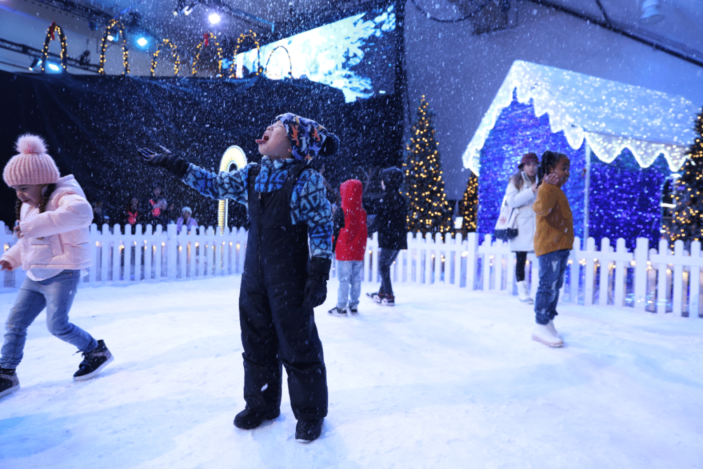 child catching snowflakes on their tongue