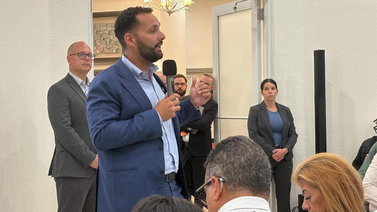 Hialeah Mayor Bryan Calvo during a town hall meeting at Hialeah Heights. Behind Calvo on his right is his chief of staff, Jose Torres. On his left is Aileen Perez, a Hialeah police officer who is part of the mayor’s security detail. Hialeah Mayor Bryan Calvo during a town hall meeting at Hialeah Heights. Behind Calvo on his right is his chief of staff, Jose Torres. On his left is Aileen Perez, a Hialeah police officer who is part of the mayor’s security detail.