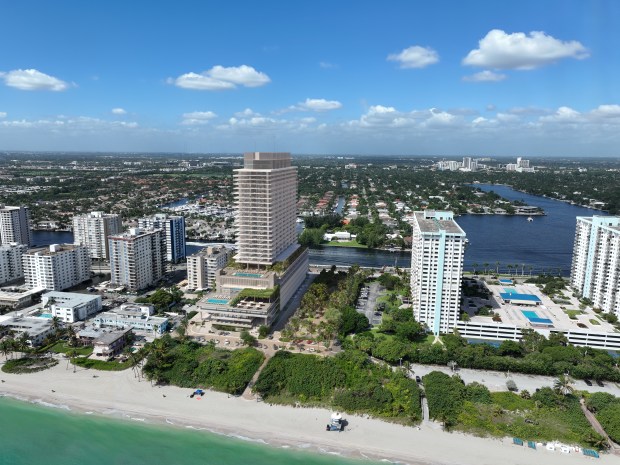 An artist's illustration shows a luxury condo tower with workforce housing apartments planned on public land at 1301 South Ocean Drive, now home to a park and community center in Hollywood. (SOM/CFE/ARX, Courtesy)