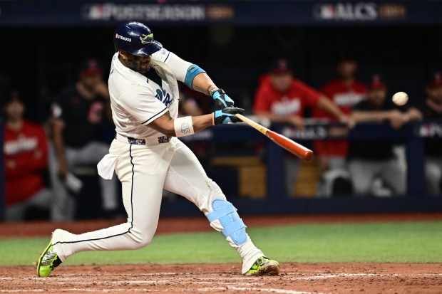 Yandy Díaz #2 of the Tampa Bay Rays hits a two run home run during the eighth inning of Monday's Game 6 of the American League Championship Series in St Petersburg, Fla. (Photo by Julio Aguilar/Getty Images)