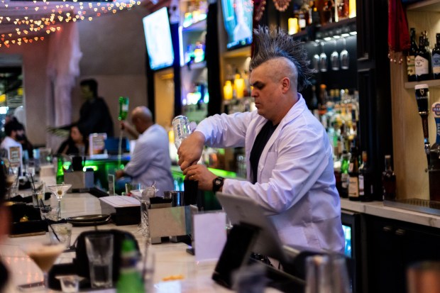 Mad scientists in lab coats serve creepy cocktails at JohnMartin's Halloween Bar in Coral Gables. (Breakwater Hospitality Group/Courtesy)