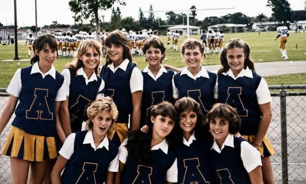 Eileen Grubba, standing second from left, was a cheerleader at St. Thomas Aquinas High School in this photo from 1983 (Eileen Grubba/Courtesy).