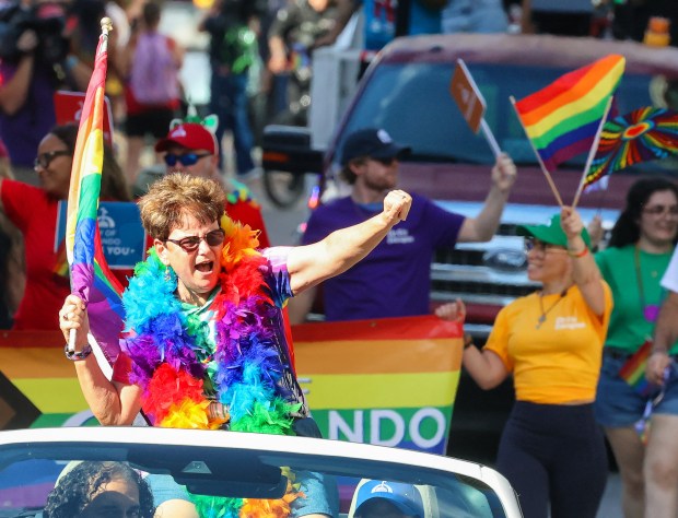 City of Orlando District 4 Commissioner Patty Sheehan leads the way as the Come Out With Pride parade makes its way down Orange Avenue. (Joe Burbank/Orlando Sentinel)