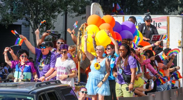 The official Come Out With Pride float makes its way down Orange Avenue during the parade in downtown Orlando, Saturday, Oct. 18, 2025. Come Out With Pride is the annual day-long festival at various venues in downtown celebrating the LGBTQIA+ community in Central Florida. More than 200,000 visitors attended the festivities, according to the City of Orlando, including the parade, fireworks, live music, and more. (Joe Burbank/Orlando Sentinel)