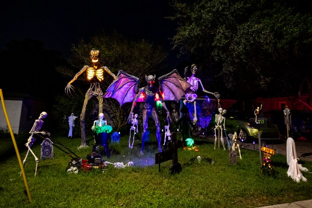 The home at 3733 S. Fern Creek Ave. in Orlando features skeletons up to tricks and Halloween high jinks on Oct. 12, 2026. (Patrick Connolly/Orlando Sentinel)