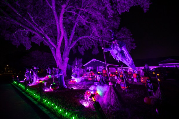 The home of the Valle family features more than a dozen witches at 2216 Chippewa Trail in Maitland on Oct. 15, 2026. (Patrick Connolly/Orlando Sentinel)