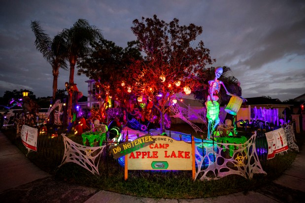 Amy Newton and her friends set up this elaborate display with a summer camp, homemade haunted mansion and more at 5008 Oak Tours Drive in Orlando on Oct. 18, 2026. The display raises money for St. Jude Children's Research Hospital. (Patrick Connolly/Orlando Sentinel)