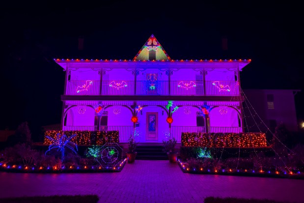 The Delaney family home at 1331 Aloma Ave. in Winter Park features bats, spiders and purple lights on their historic home. (Courtesy of Brooke Delaney)