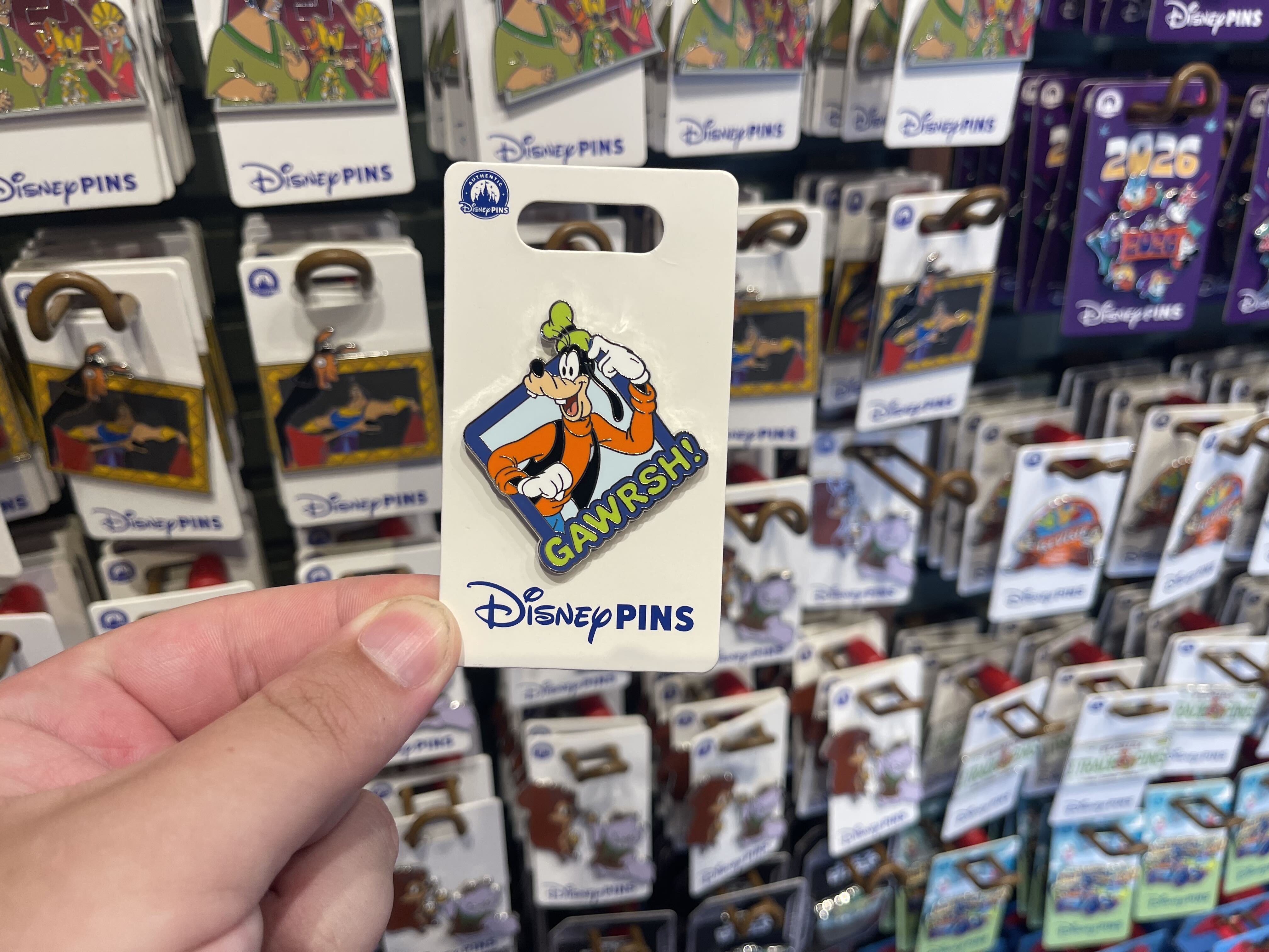 Five new open edition pins feature familiar Disney characters, from Goofy’s signature “Gawrsh!” to Rapunzel and Flynn Rider sharing a moment beside a campfire.