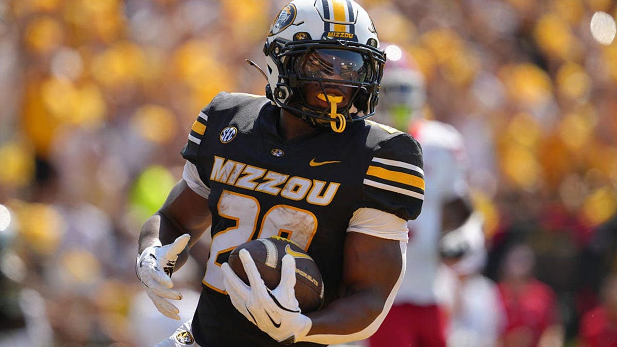 Running back Ahmad Hardy running for a touchdown at Faurot Field in Columbia, Missouri