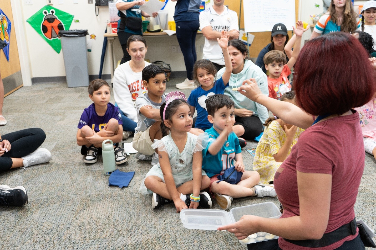 Aileen Herrera, clinical director of Brave Bunch encouraging the children to raise their hand during Bravery Lesson