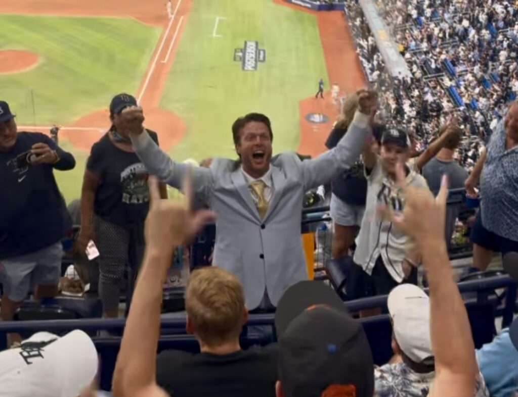 People celebrating at a Rays playoff game