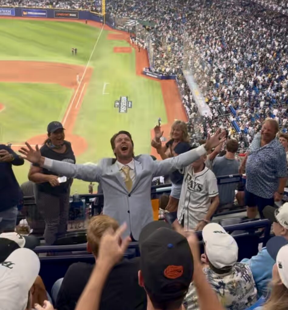 People celebrating at a Rays playoff game