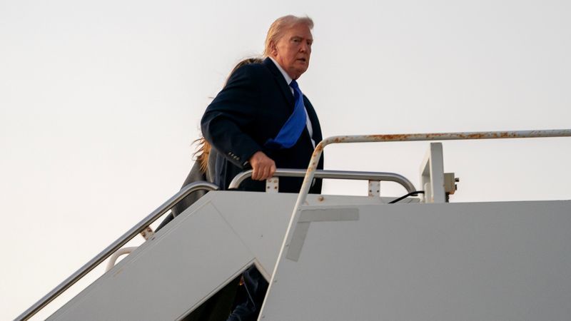 WEST PALM BEACH, FLORIDA - FEBRUARY 16: U.S. President Donald Trump boards Air Force One at Palm Beach International Airport on February 16, 2026 in West Palm Beach, Florida. President Trump is returning to Washington, DC after a long Presidents Day weekend in Florida. (Photo by Nathan Howard/Getty Images)