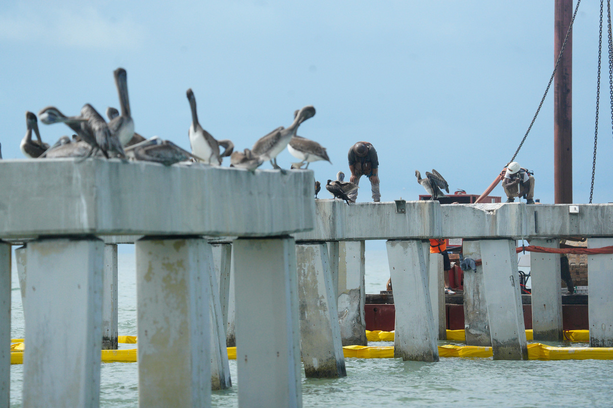 Progress on the removal of the destroyed iconic Fort Myers Beach pier continues on Tuesday, Sept. 22, 2026. A new pier is replacing the old one that was decimated in Hurricane Ian in 2022.