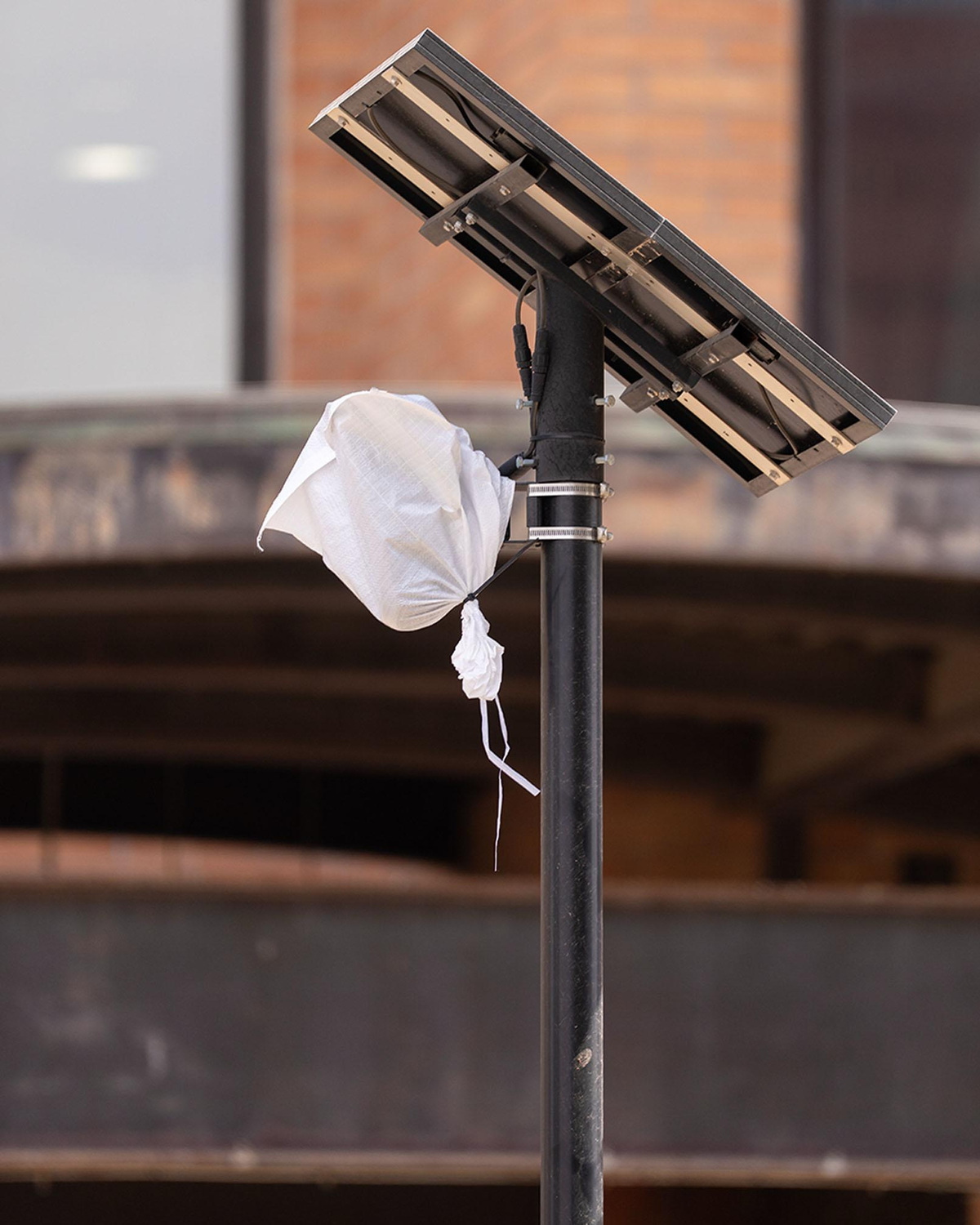A bag covers a Flock camera in Tempe.