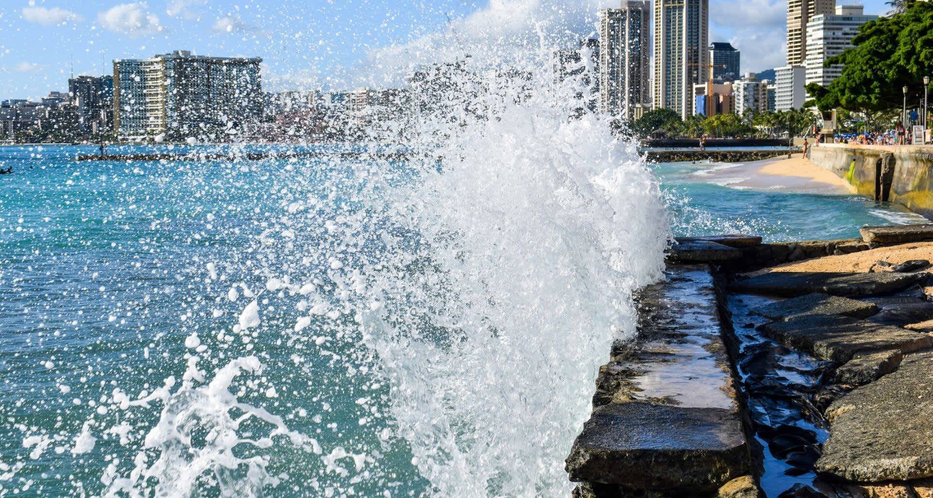 Waves crashing into a seawall.