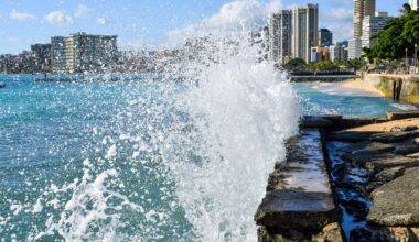 Waves crashing into a seawall.