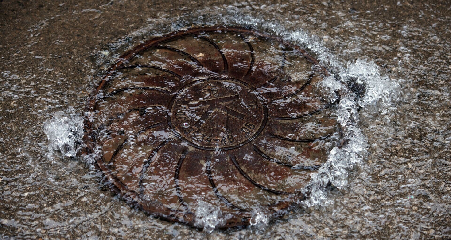 Water flowing out of a manhole.
