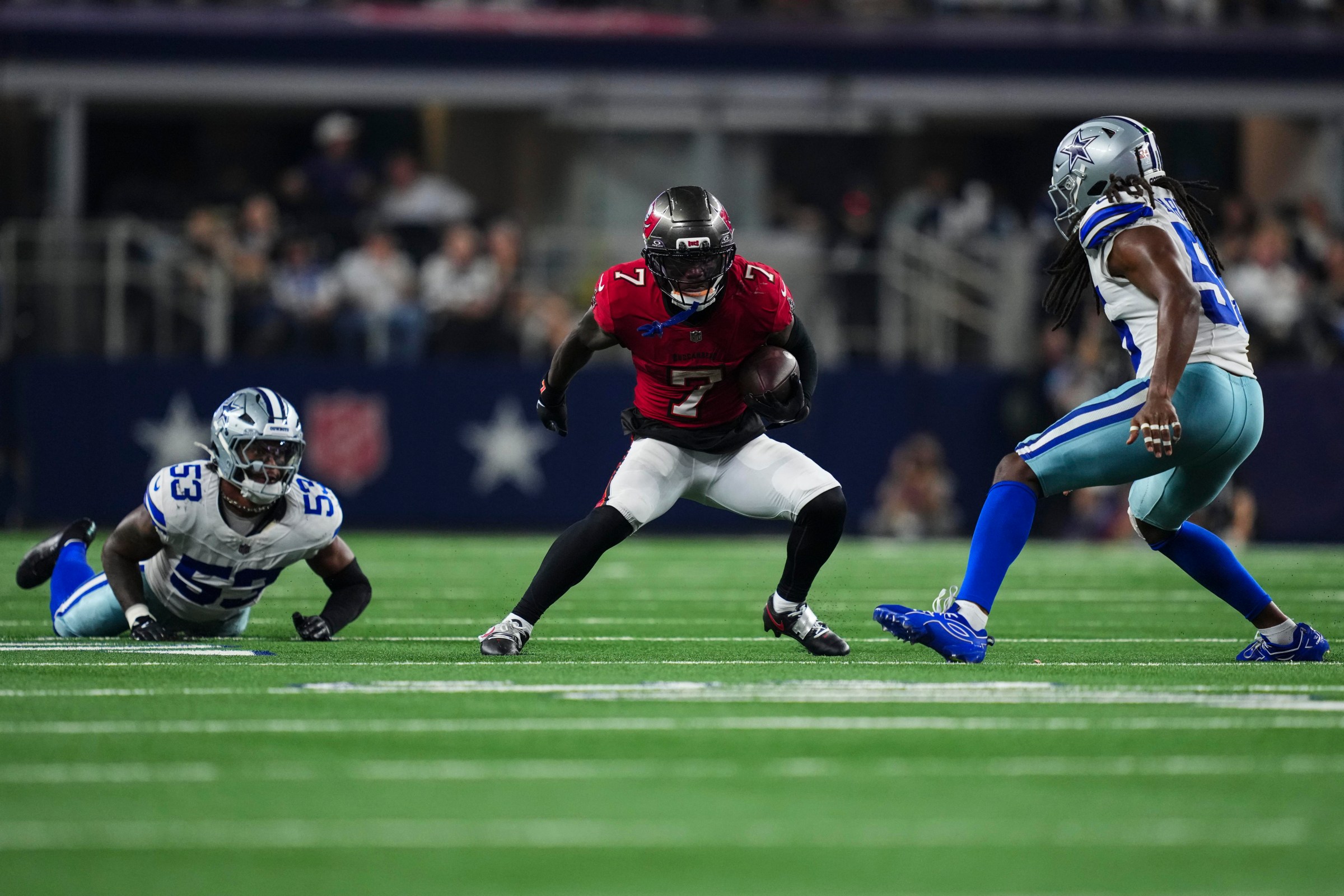 ARLINGTON, TX - OCTOBER 08: Bucky Irving #7 of the Tampa Bay Buccaneers runs the ball during an NFL football game against the Dallas Cowboys at AT&T Stadium on October 8, 2026 in Arlington, Texas. (Photo by Cooper Neill/Getty Images)