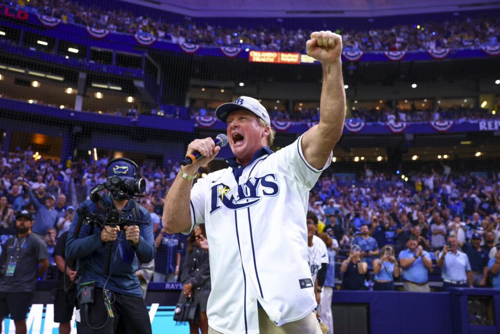 People celebrating at a Rays playoff game