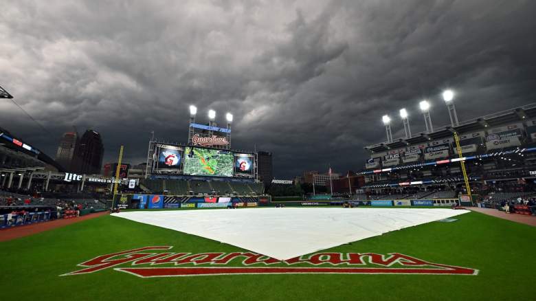 The rain tarp sits on the infield of Progressive Field during the third inning