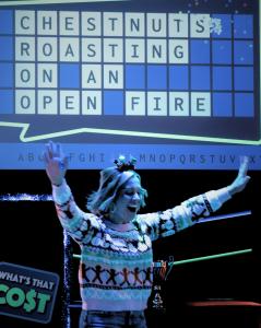 Guests participate in holiday-themed game show challenges featuring head-to-head competitions, interactive props, and professional game show hosts at Game Show Battle Rooms Jacksonville.