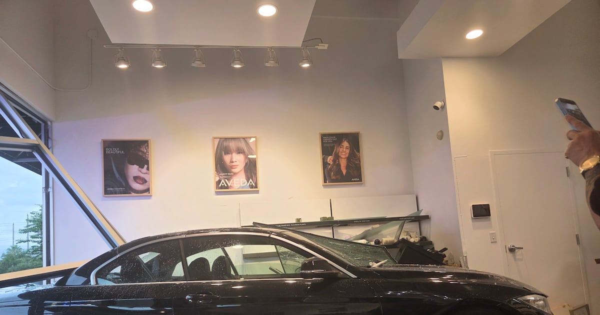 Car crashes into St. Johns Town Center salon, pinning couple, injuring them, and shocking onlookers