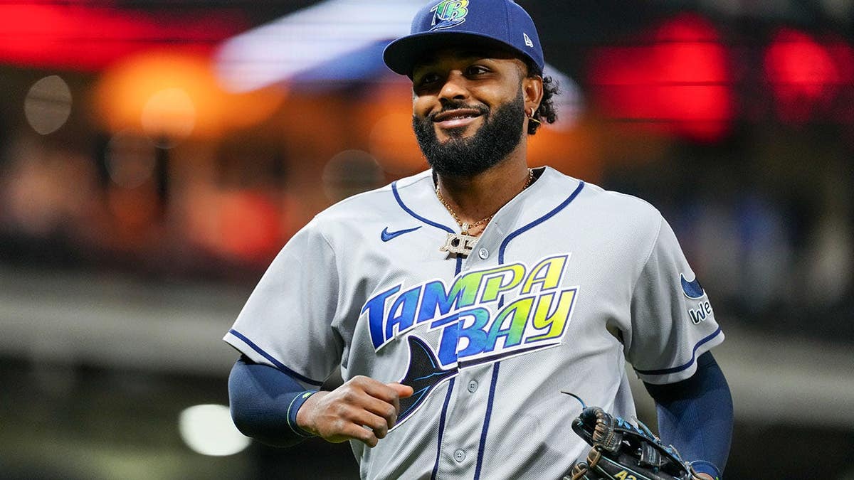 Junior Caminero #13 leaves the field during Game 5 of the American League Championship Series.