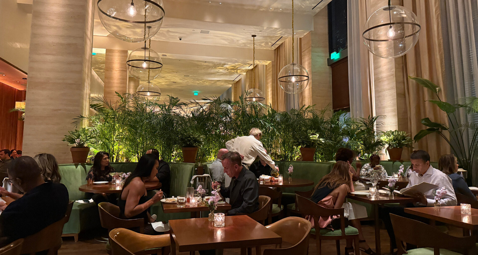 Food and the dining room at Lilac at the Edition Tampa